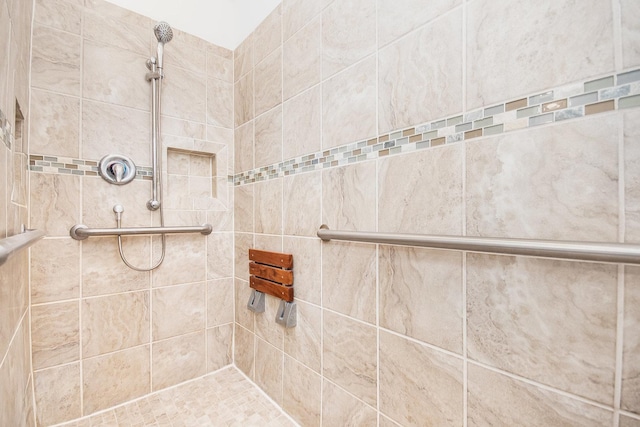 full bathroom with tiled shower