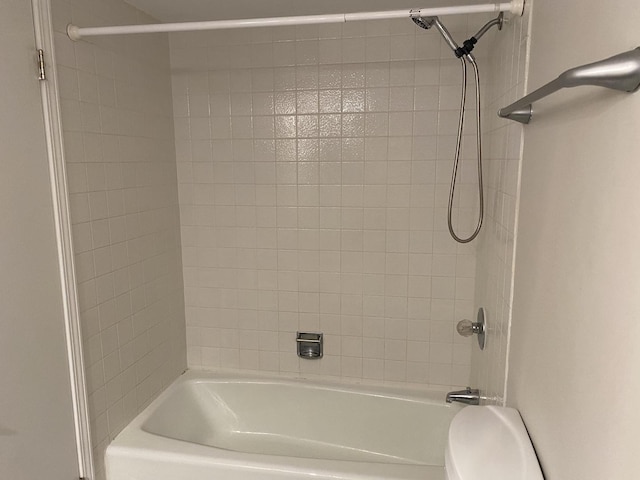 bathroom featuring toilet and shower / bath combination