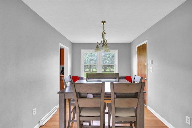 307 Dodson Dr W, Urbana, IL 61802 - dining room with light wood-style floors and baseboards