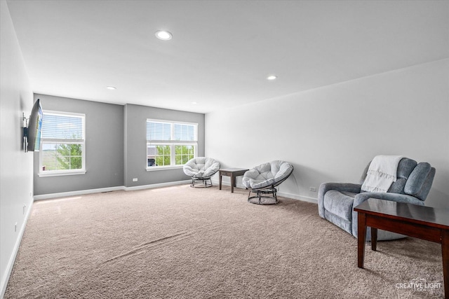 living area featuring carpet floors, recessed lighting, and baseboards