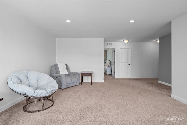 sitting room featuring baseboards, carpet, recessed lighting, and visible vents