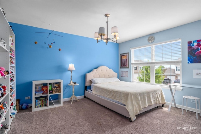 bedroom featuring baseboards, carpet flooring, and a chandelier
