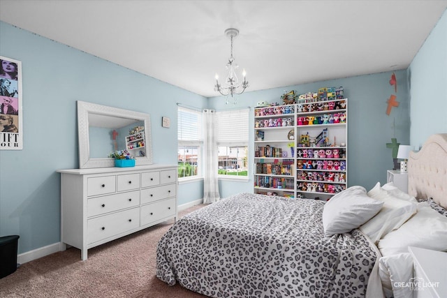 carpeted bedroom with baseboards and a chandelier