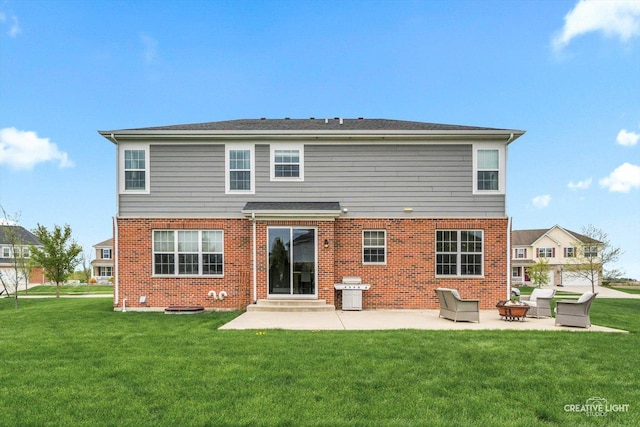 back of property featuring brick siding, a patio area, a lawn, and entry steps