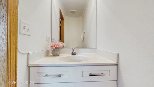 bathroom featuring vanity and crown molding