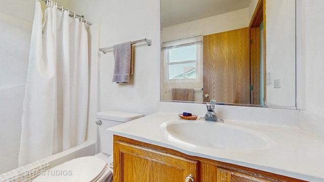 full bath featuring toilet, vanity, and shower / bath combination with curtain