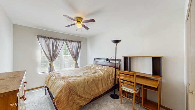 bedroom with carpet, baseboards, a desk, and a ceiling fan