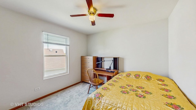 carpeted bedroom featuring baseboards and ceiling fan