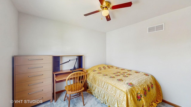 carpeted bedroom featuring baseboards, an office area, and a ceiling fan