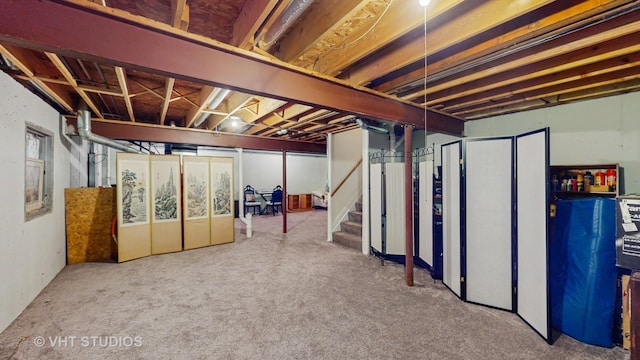unfinished basement featuring stairway and carpet