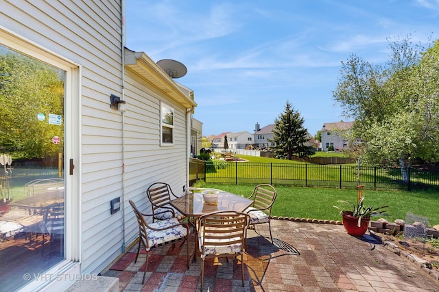view of patio featuring outdoor dining area and a residential view