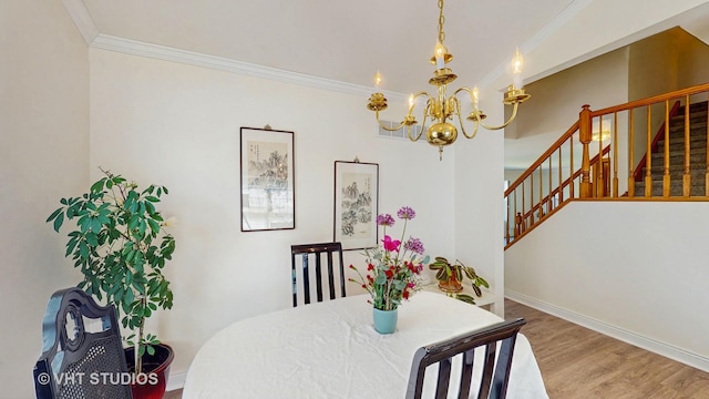 dining area featuring a chandelier, crown molding, stairway, wood finished floors, and baseboards