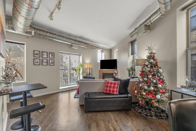 living room featuring wood finished floors and baseboards