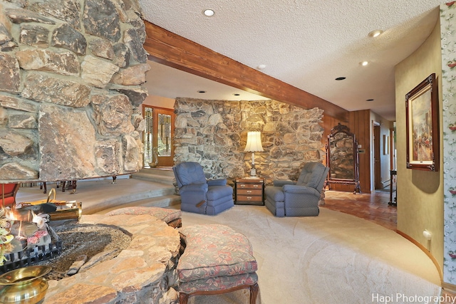 living room featuring beam ceiling, carpet flooring, a textured ceiling, and recessed lighting