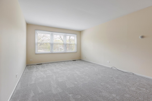 907 Banbury Ct, Schaumburg, IL 60194 - carpeted empty room with baseboards