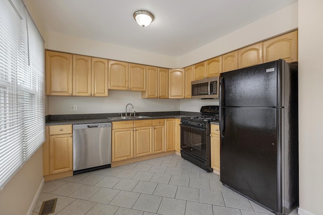 907 Banbury Ct, Schaumburg, IL 60194 - kitchen featuring dark countertops, light brown cabinetry, black appliances, and a sink
