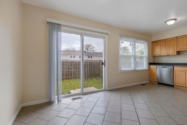 907 Banbury Ct, Schaumburg, IL 60194 - kitchen with light brown cabinets, baseboards, dark countertops, and dishwasher