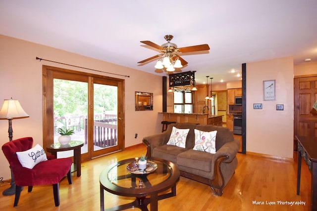5N850 Ravine Dr, Saint Charles, IL 60175 - living room with light wood finished floors, ceiling fan, and baseboards