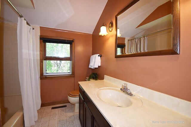 5N850 Ravine Dr, Saint Charles, IL 60175 - bathroom with vaulted ceiling, tile patterned floors, toilet, vanity, and shower / bath combination with curtain