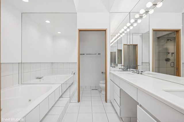 bathroom with a whirlpool tub, tile patterned flooring, toilet, double vanity, and a stall shower
