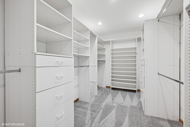spacious closet featuring carpet floors