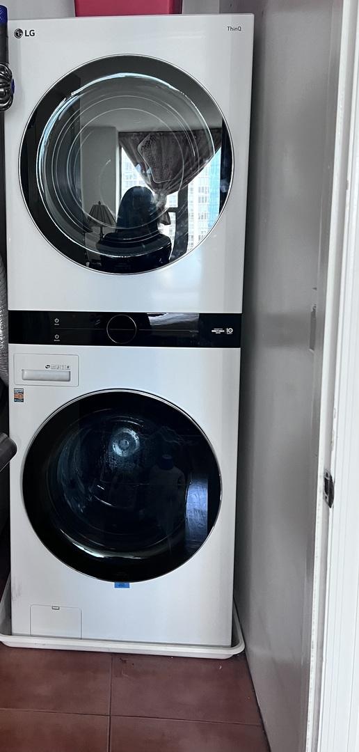 400 E Randolph St Unit 3018, Chicago, IL 60601 - washroom with stacked washer and clothes dryer and tile patterned flooring