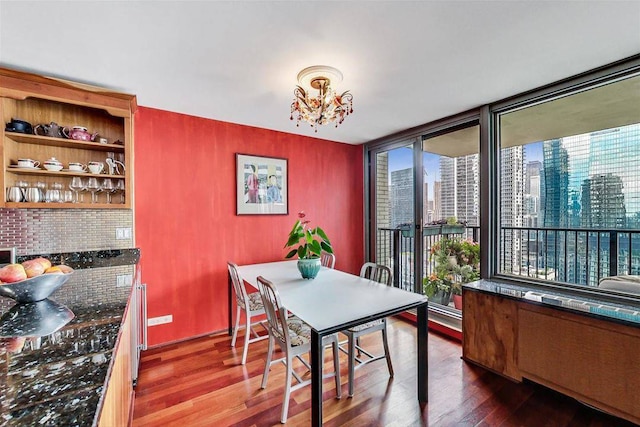 400 E Randolph St Unit 3018, Chicago, IL 60601 - dining area with dark wood finished floors, healthy amount of natural light, a view of city, and a chandelier
