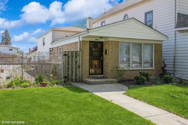 545 Morris Ave, Bellwood, IL 60104 - view of front of house with brick siding and a chimney