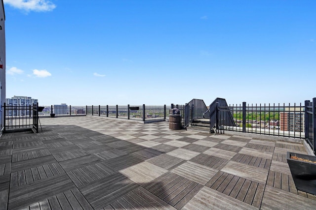 view of patio featuring fence