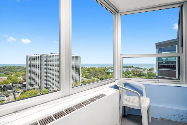 sunroom / solarium with a water view