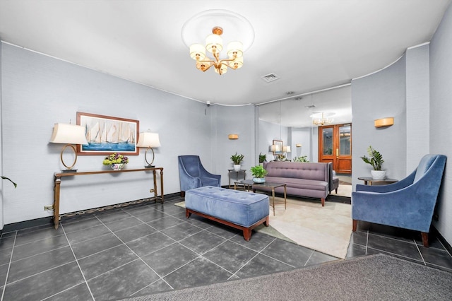 living room featuring a chandelier and tile patterned flooring