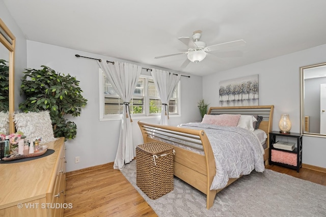 1008 W Weathersfield Way, Schaumburg, IL 60193 - bedroom featuring light wood-style floors, baseboards, and a ceiling fan