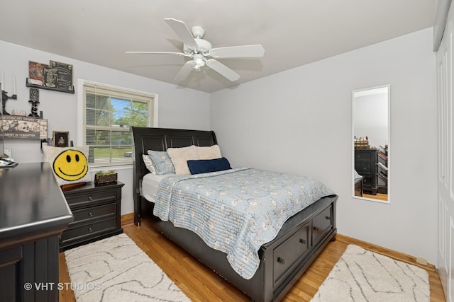 1008 W Weathersfield Way, Schaumburg, IL 60193 - bedroom featuring light wood finished floors, baseboards, and ceiling fan