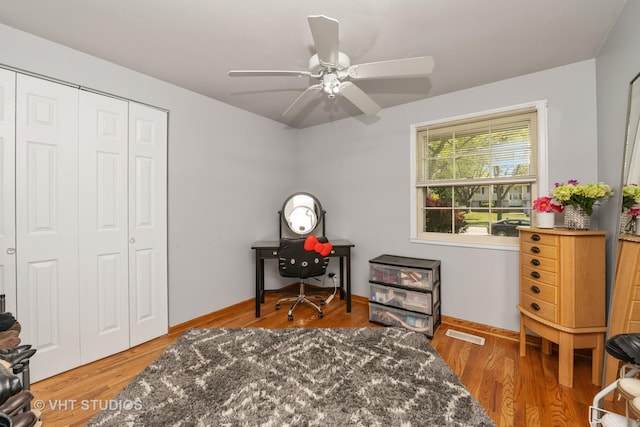1008 W Weathersfield Way, Schaumburg, IL 60193 - bedroom featuring a closet, wood finished floors, and ceiling fan