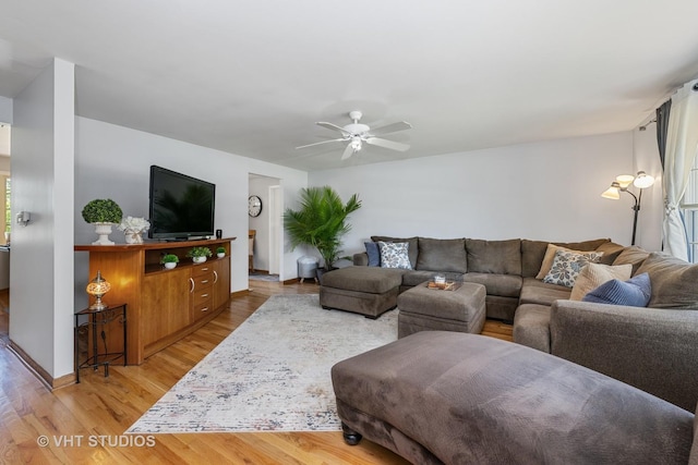 1008 W Weathersfield Way, Schaumburg, IL 60193 - living area with a ceiling fan, light wood finished floors, plenty of natural light, and baseboards