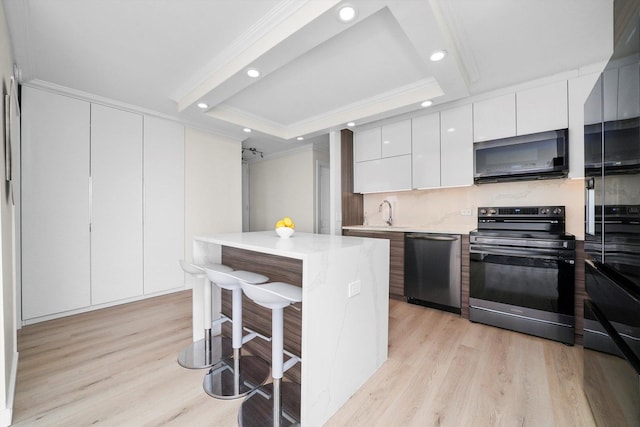 kitchen with range with electric stovetop, ornamental molding, dishwasher, light wood-style flooring, and modern cabinets