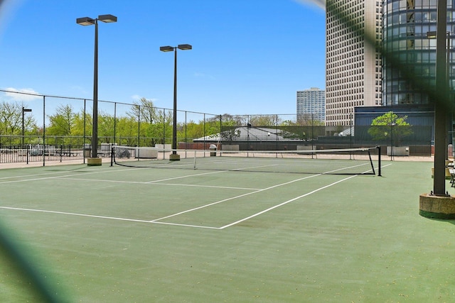 view of sport court with fence
