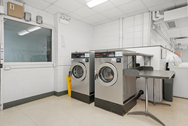 common laundry area with independent washer and dryer and visible vents