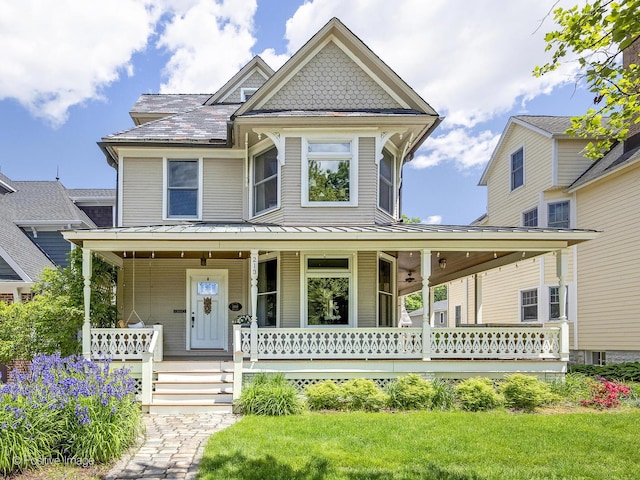 213 S Ashland Ave, La Grange, IL 60525 - victorian-style house featuring covered porch and a front yard