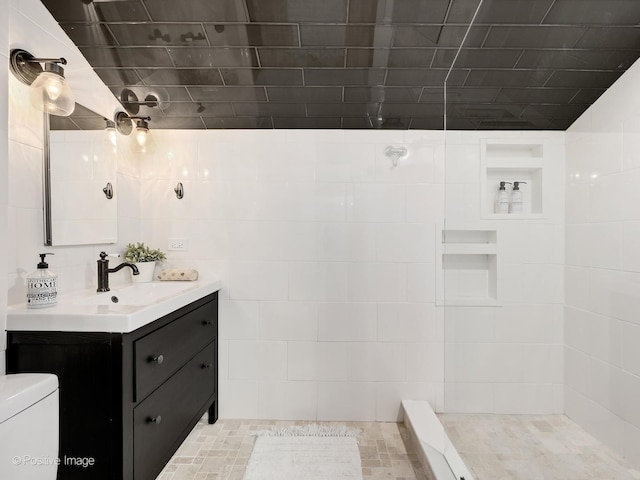 213 S Ashland Ave, La Grange, IL 60525 - bathroom featuring vanity, toilet, and a tile shower