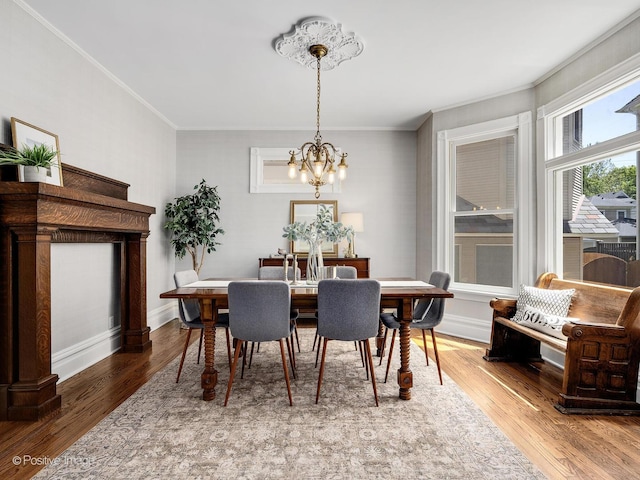 213 S Ashland Ave, La Grange, IL 60525 - dining room featuring crown molding, a chandelier, and wood finished floors