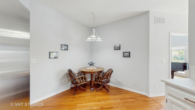 23118 Lacroix Ln, Plainfield, IL 60544 - dining space with a chandelier and light wood-style flooring