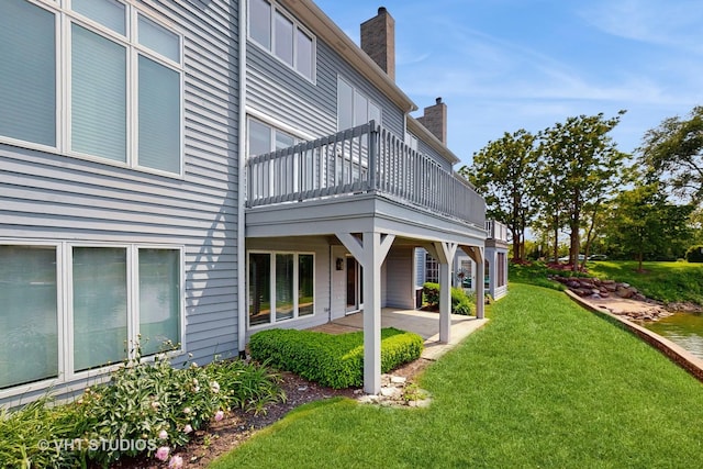 23118 Lacroix Ln, Plainfield, IL 60544 - back of property featuring a chimney, a patio area, and a lawn