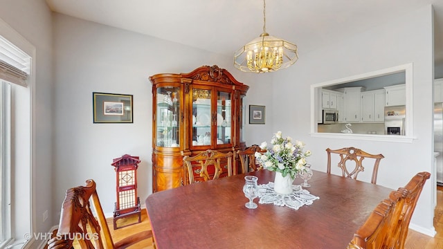 23118 Lacroix Ln, Plainfield, IL 60544 - dining room featuring a chandelier and light wood finished floors