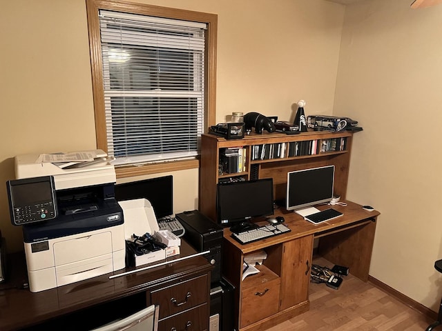 office with baseboards and wood finished floors