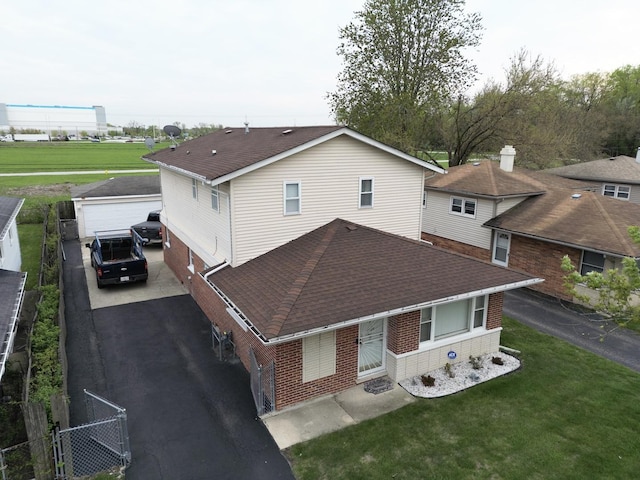 2327 W 157th Pl, Markham, IL 60428 - back of house with brick siding, roof with shingles, and an outdoor structure