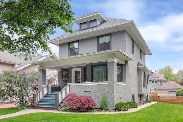traditional style home with stucco siding and a porch