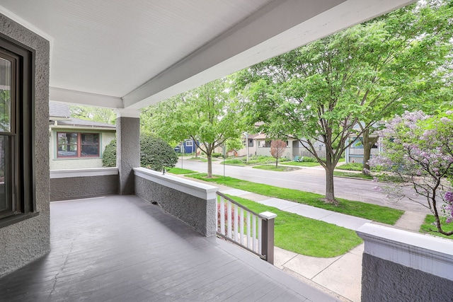 view of patio / terrace featuring covered porch and a residential view
