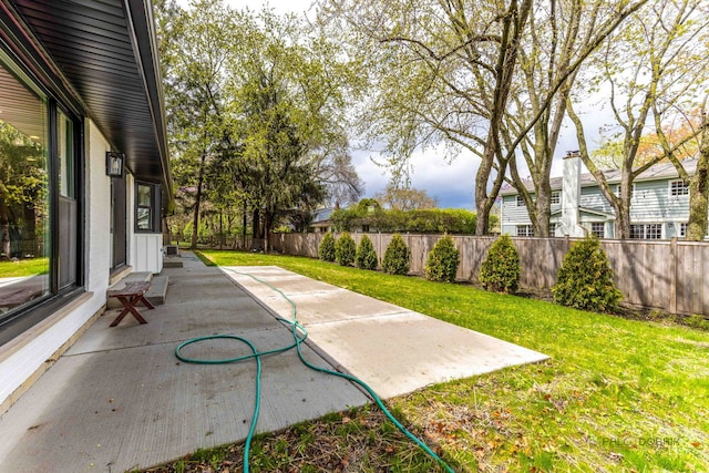 view of yard with a fenced backyard and a patio