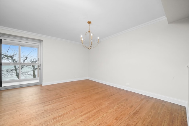 empty room featuring an inviting chandelier, baseboards, crown molding, and light wood-type flooring